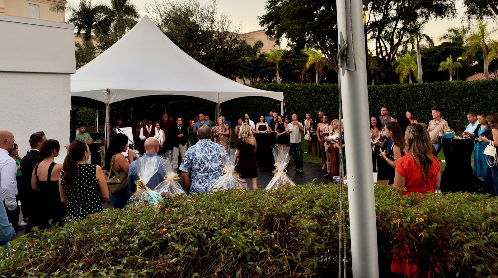 KW Elevate Luxury Grand Opening crowd at sunset in Naples, FL - corporate event entertainment by James Grande