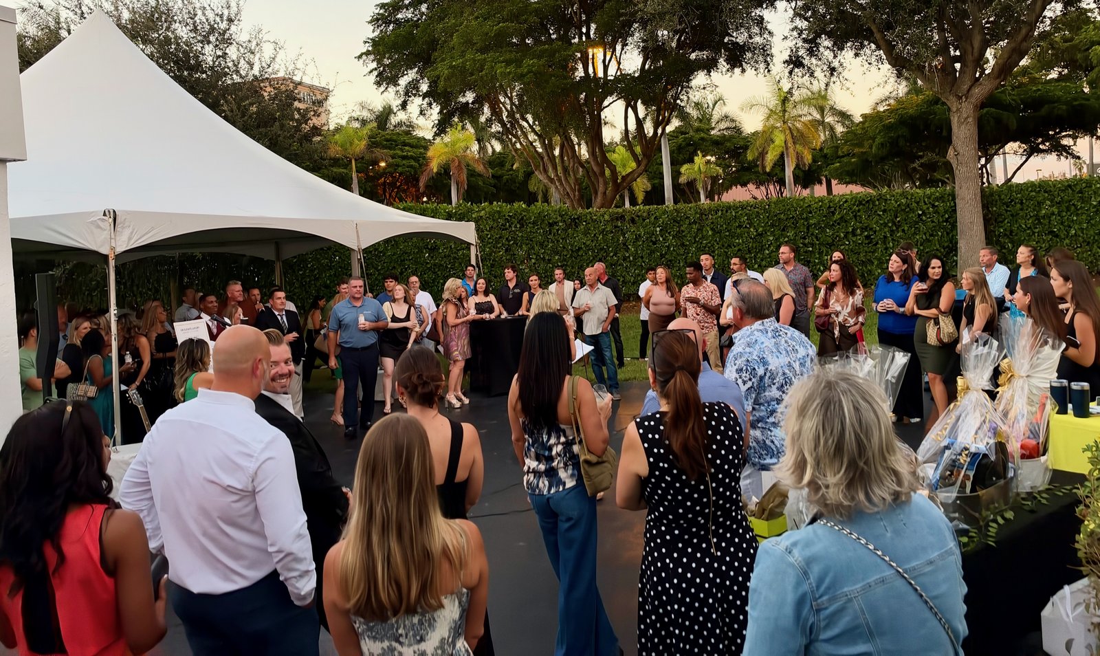 Naples, FL grand opening party crowd - live entertainment by singer-guitarist James Grande